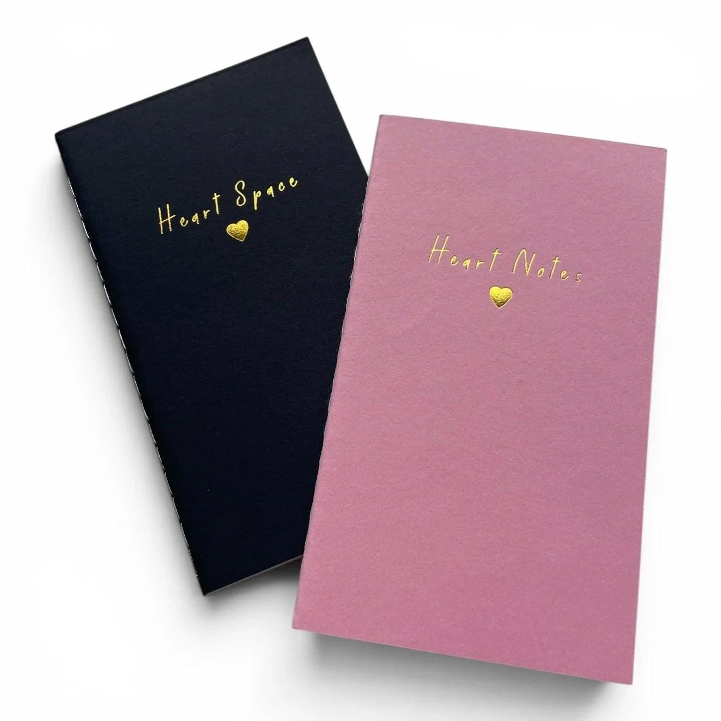Heart-themed notebooks in black and pink with gold foil text and heart designs