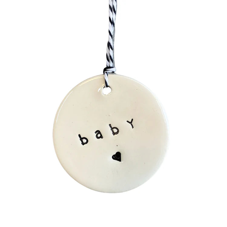 'baby 🖤' ceramic tag