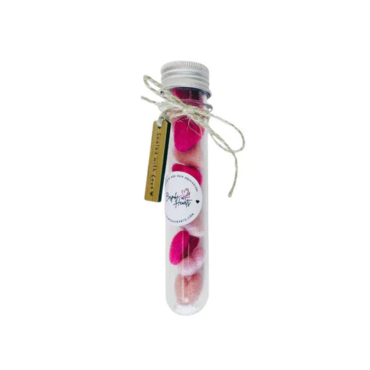 Mini felt hearts in a gift tube.