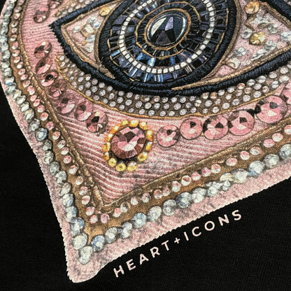 Detail of the Lover's Eye Tee by Bespoke Hearts featuring an ornate, jeweled heart design.