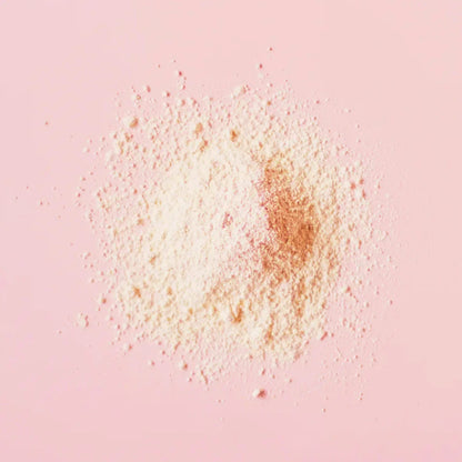 Soft pink face mask powder on pastel background