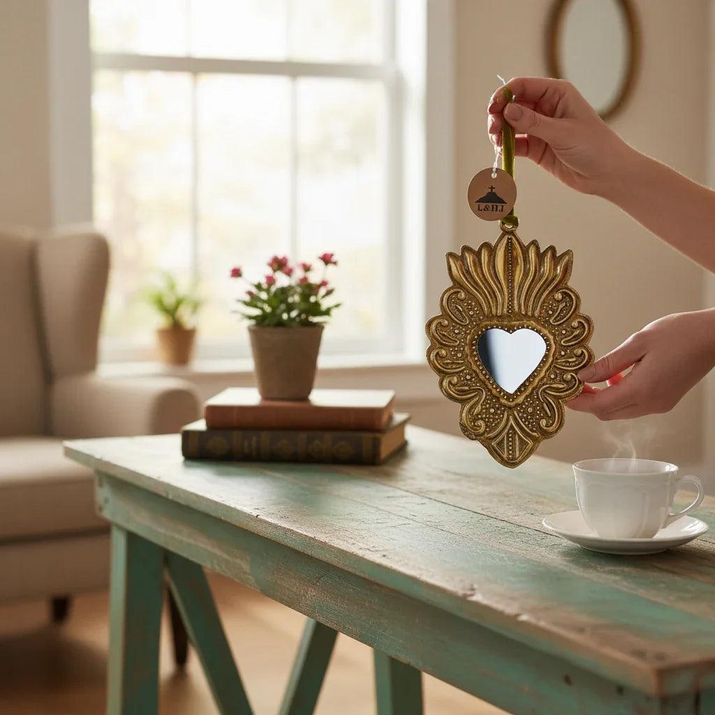 Heart-shaped gold mirror with ornate frame.